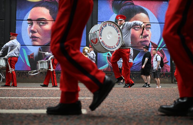 Orangemen and band members take part in the annual Twelfth of July parade in Belfast. Photograph: Charles McQuillan/Getty Images