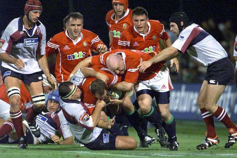 Richard Hill and Keith Wood of the Lions burst through the Queensland defence in 2001 - Hill's injury in the second test would be a major controversy. Photograph: Billy Stickland/Inpho