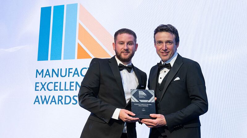 Adam Kane, community lead at Business River, presents the manufacturer of the year - small business award to John Byrne, Hygeia