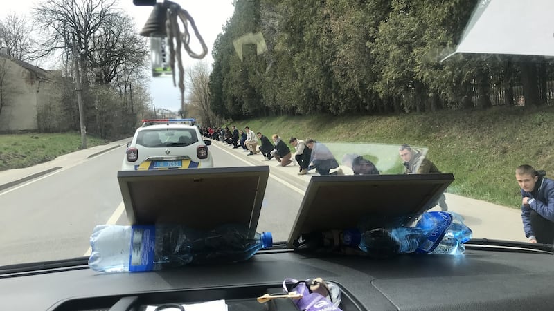 A hearse carries the body of Ivan Myno: ‘Lots of people knelt on the roadside in the falling snow as we passed. They came out to honour a hero.’ Photograph: Yaryna Chuchman