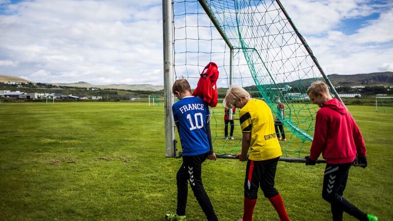 Teenage boys attend a training session at the football club Afturelding in Mosfellsbaer, near Reykjavik. In Iceland a “leisure card”, worth €430 a year, is available for children to help fund out-of-school activities. Photograph: Karl Petersson/AFP